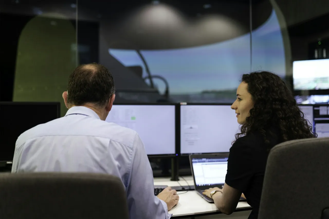 Service dispatchers at a console with monitors